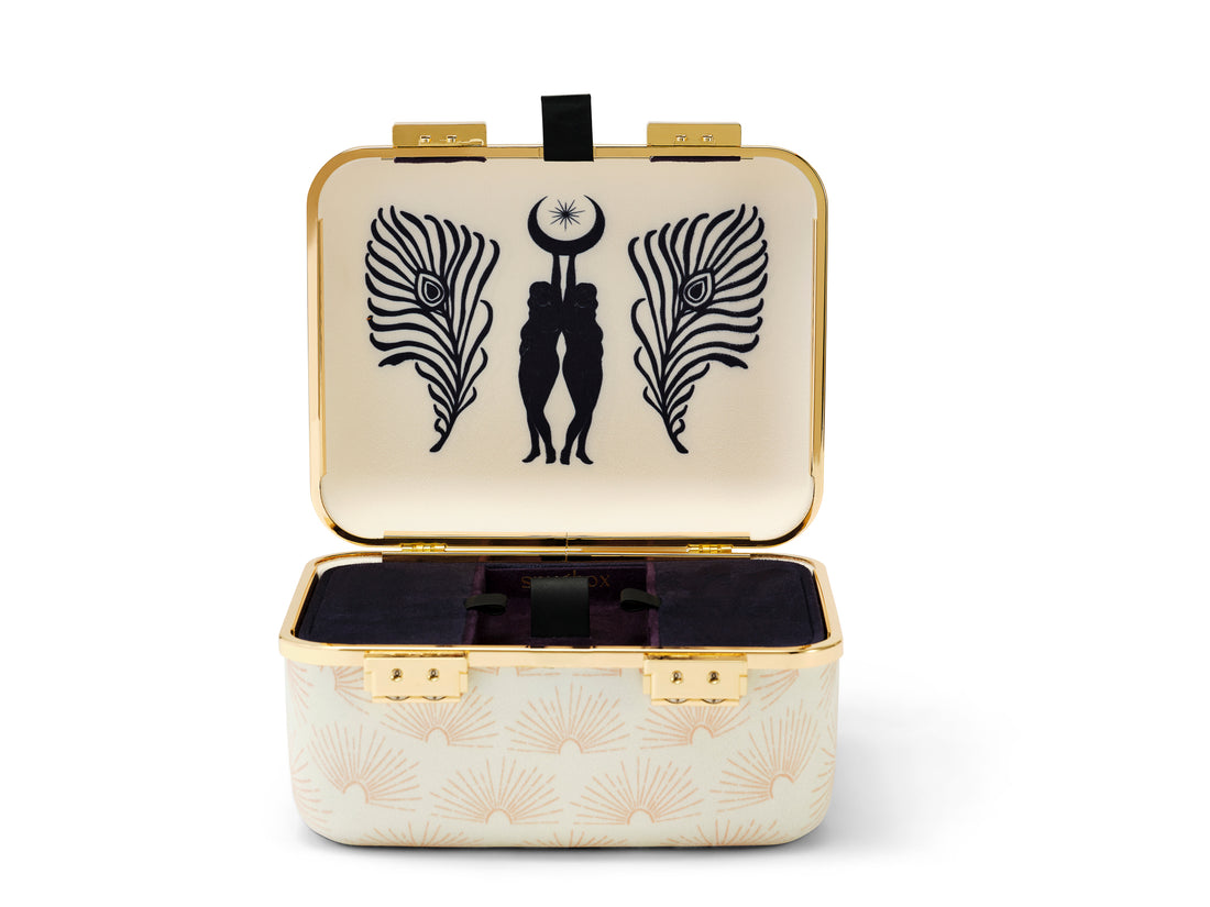 Our Celestial style stash box features a sunburst pattern on the exterior with a black Gemini interior motif. Secured with two gold combination locks. Super soft ultra-suede upholstery all around.
